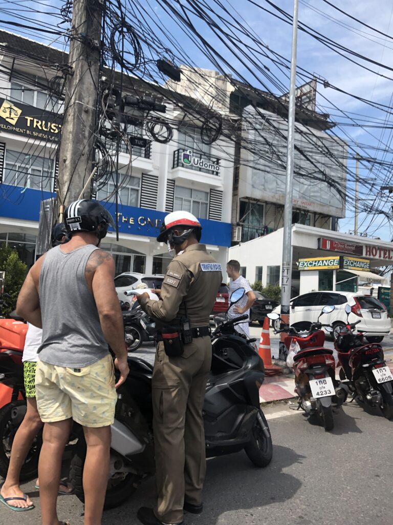 Police stop tourist motorbike for check driver lincense