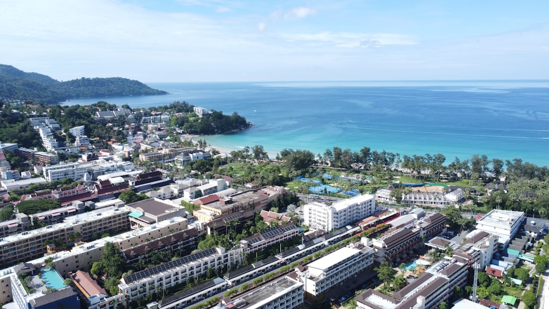 Nai Harn & Rawai Complete Scooter Explorer’s Guide 2026 3 A bird's eye view of a city by the ocean