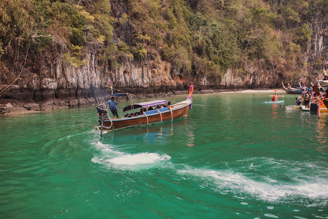 Nai Harn & Rawai Complete Scooter Explorer’s Guide 2026 4 a group of people riding on top of a boat