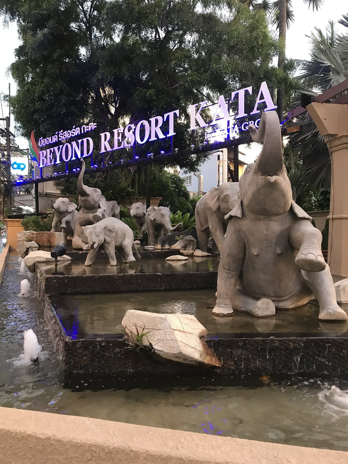 Entrance sign of Beyond Resort Kata with elephant statues and a fountain in Phuket