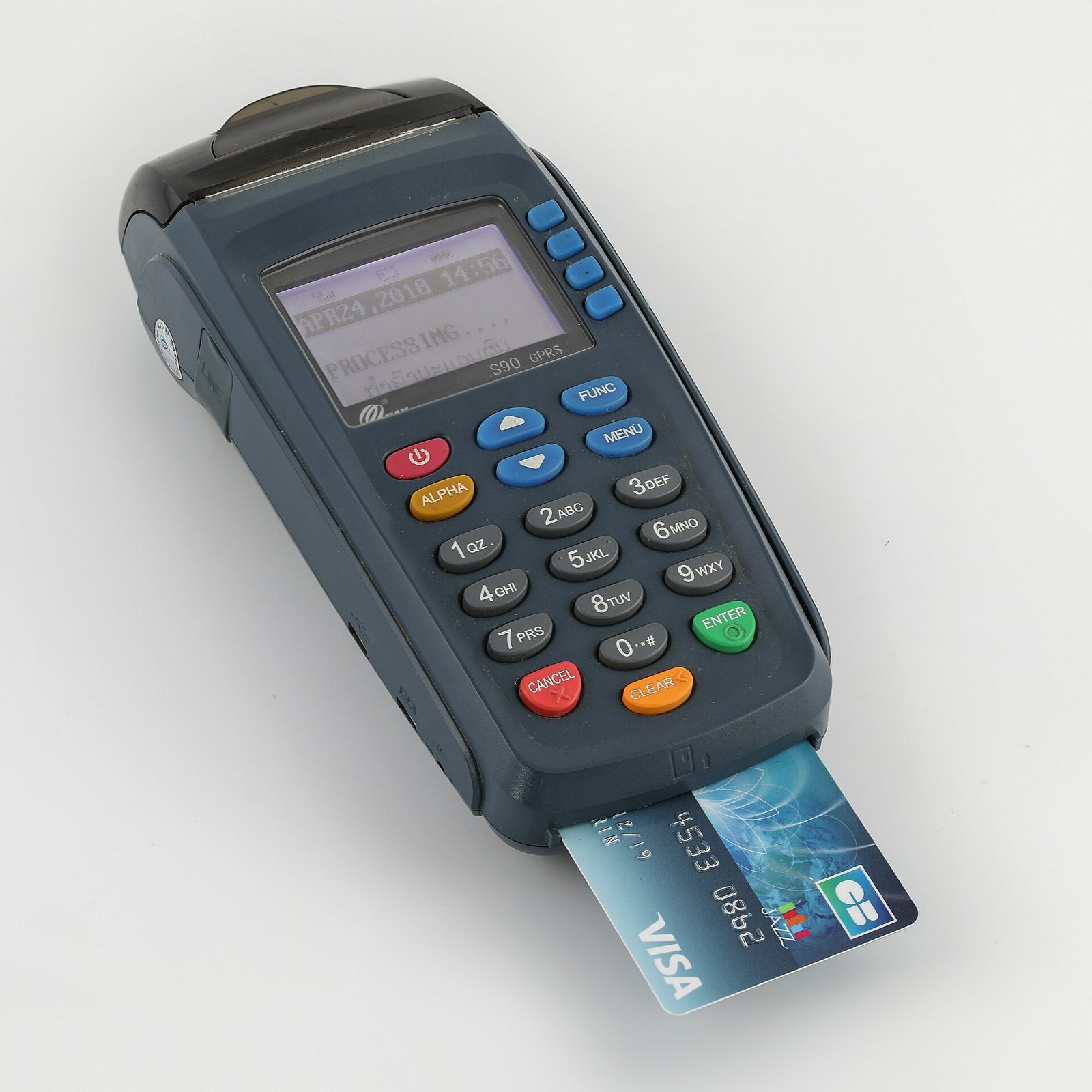Visa credit card inserted in a card payment terminal
