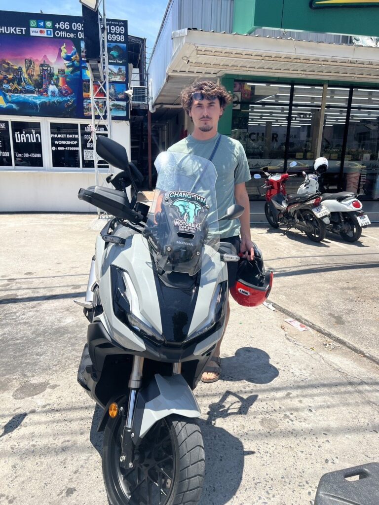 Motorbike Rental in Chalong 6 Customer with a white Honda ADV scooter at the Chang Thai Chalong branch