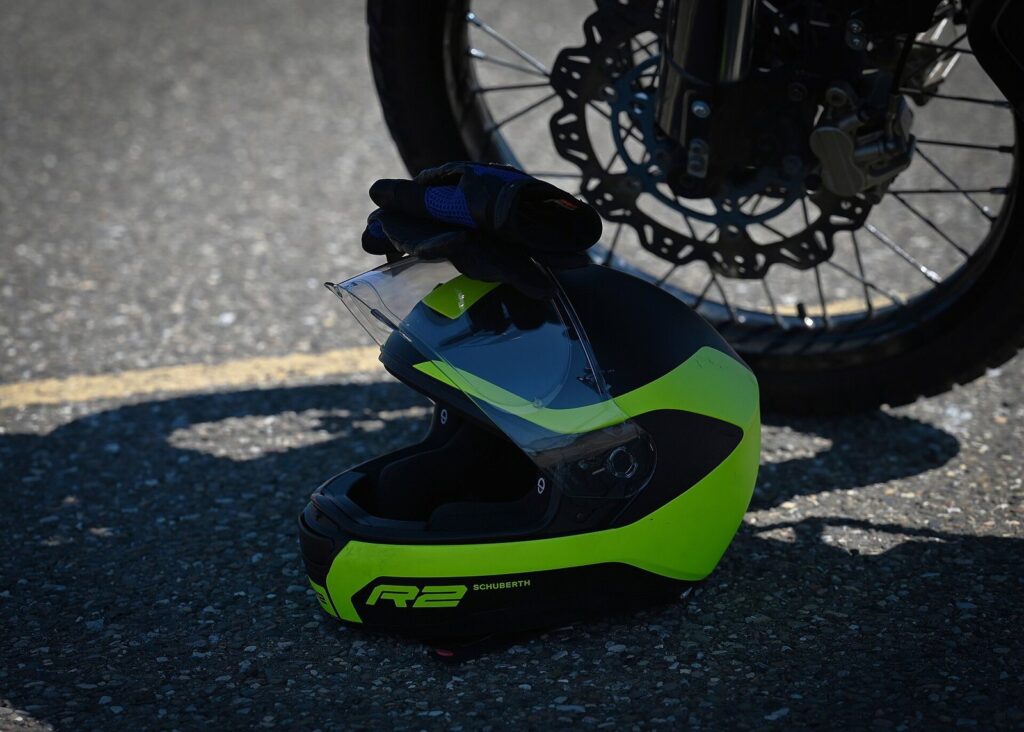 Thai Traffic Law for Motorbike Travelers in Phuket: A Complete Guide 3 Full face motorcycle helmet resting on a motorcycle in the sun