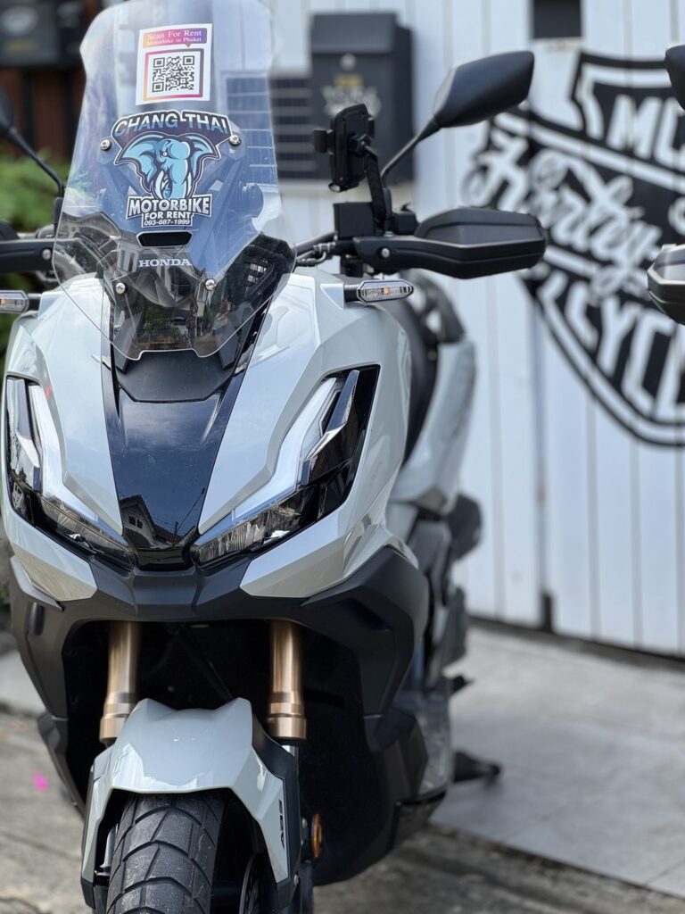 Motorbike Rental in Phuket Old Town 4 Grey Honda ADV scooter with the Chang Thai windscreen sticker, parked in Phuket Town