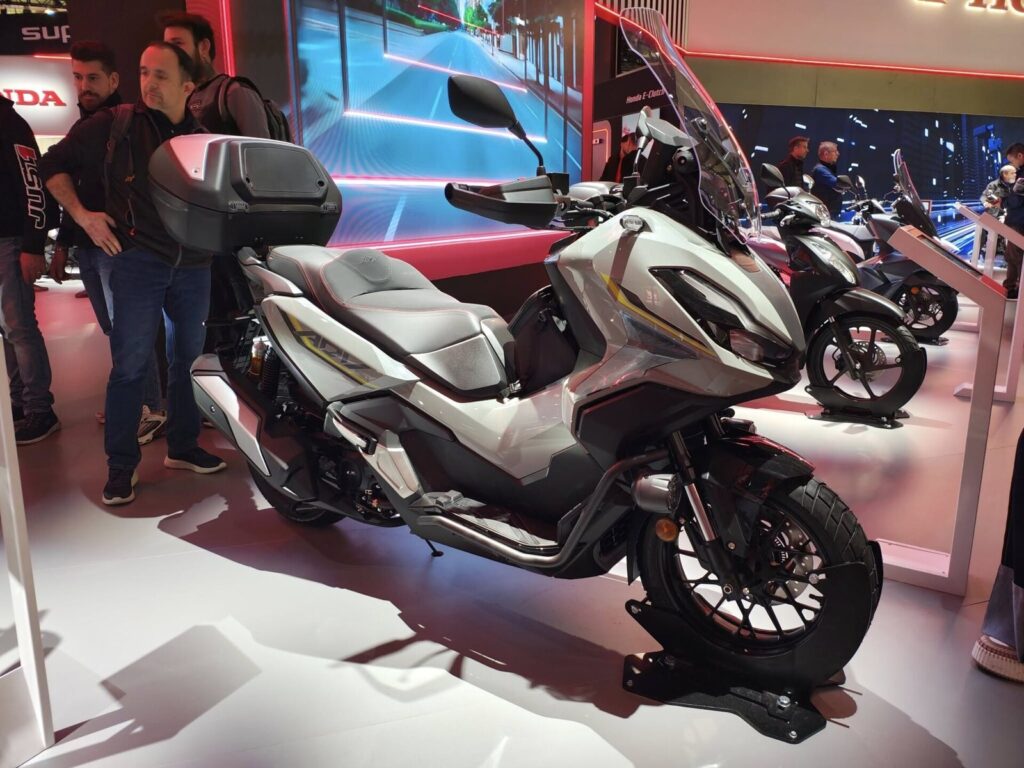 Honda ADV 350 adventure scooter on display at a motorcycle show