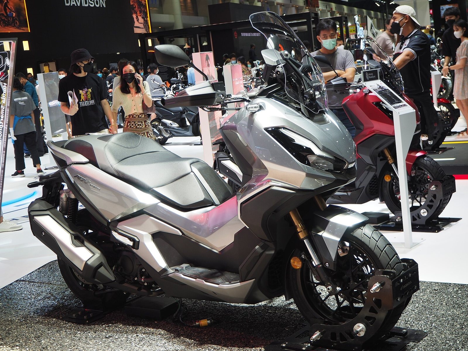 Honda ADV350 adventure scooter on display at a motorcycle show