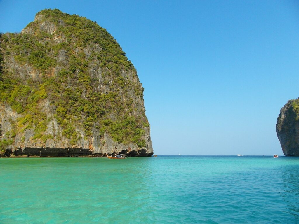 Ride Your Scooter to the Pier: The Cheapest Way to Reach Phi Phi, Racha and Coral Island 3 Limestone cliffs and turquoise water at Maya Bay on Koh Phi Phi, Thailand