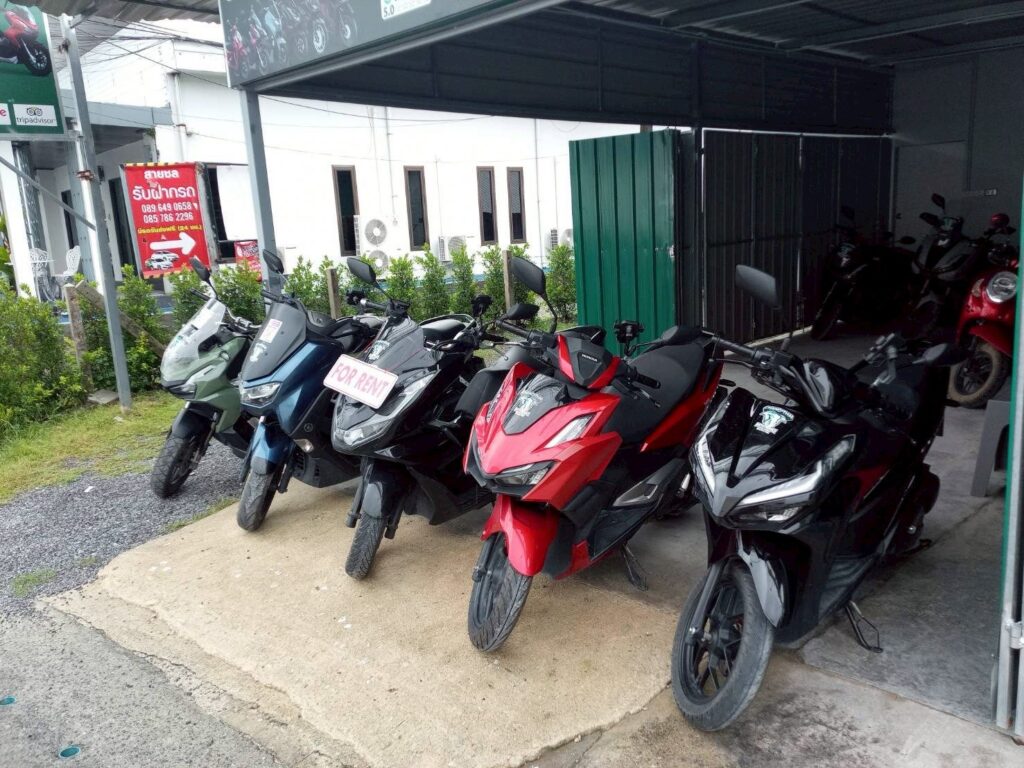 Motorbike Rental at Phuket International Airport 5 Rental scooters parked under a canopy at the Chang Thai Phuket Airport branch, ready for pickup