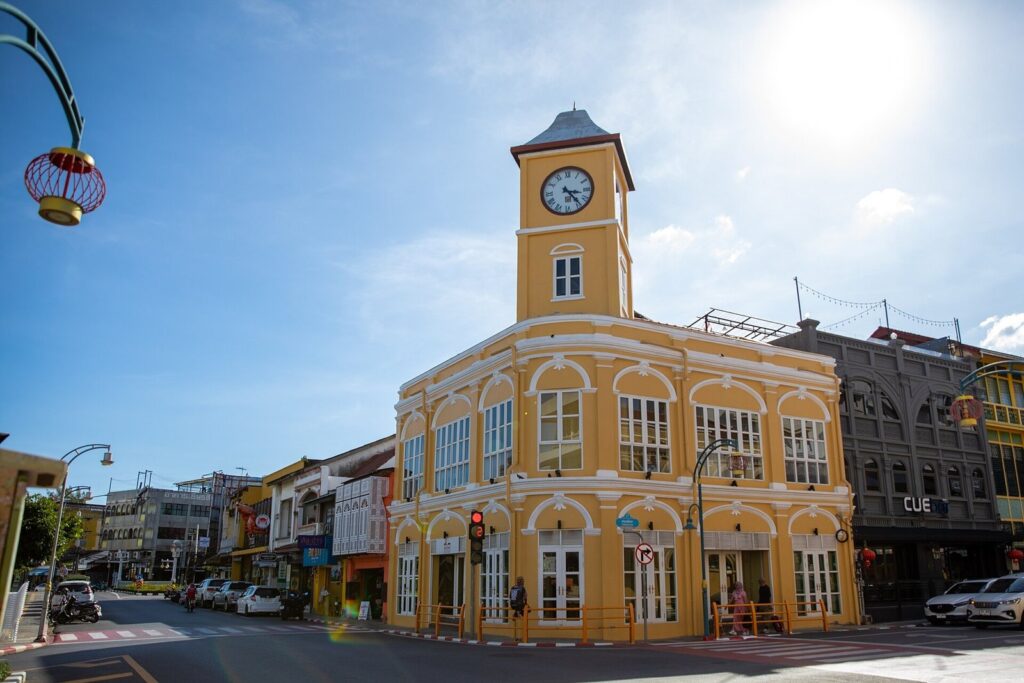 Phuket Immigration Office: Complete 2026 Guide for Long-Stay Visitors 3 Yellow clock tower building on a street corner in Phuket Old Town