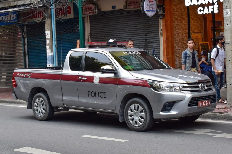 Royal Thai Police Toyota Hilux traffic patrol pickup parked on a city street